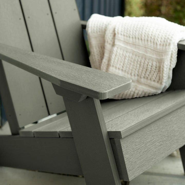 Close up of light green Italica Modern Adirondack Chair with blanket
