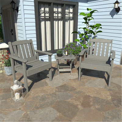 Two gray Lehigh garden chairs and folding side table on stone patio. 