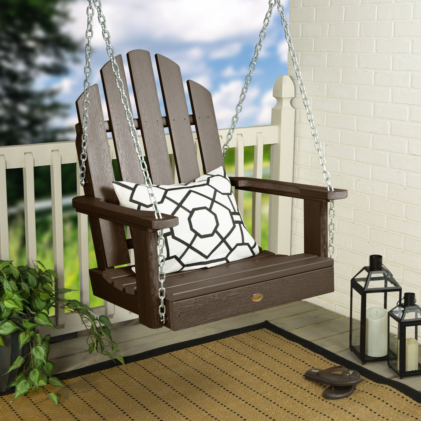 Brown Single Seat Westport Swing on porch with pillow