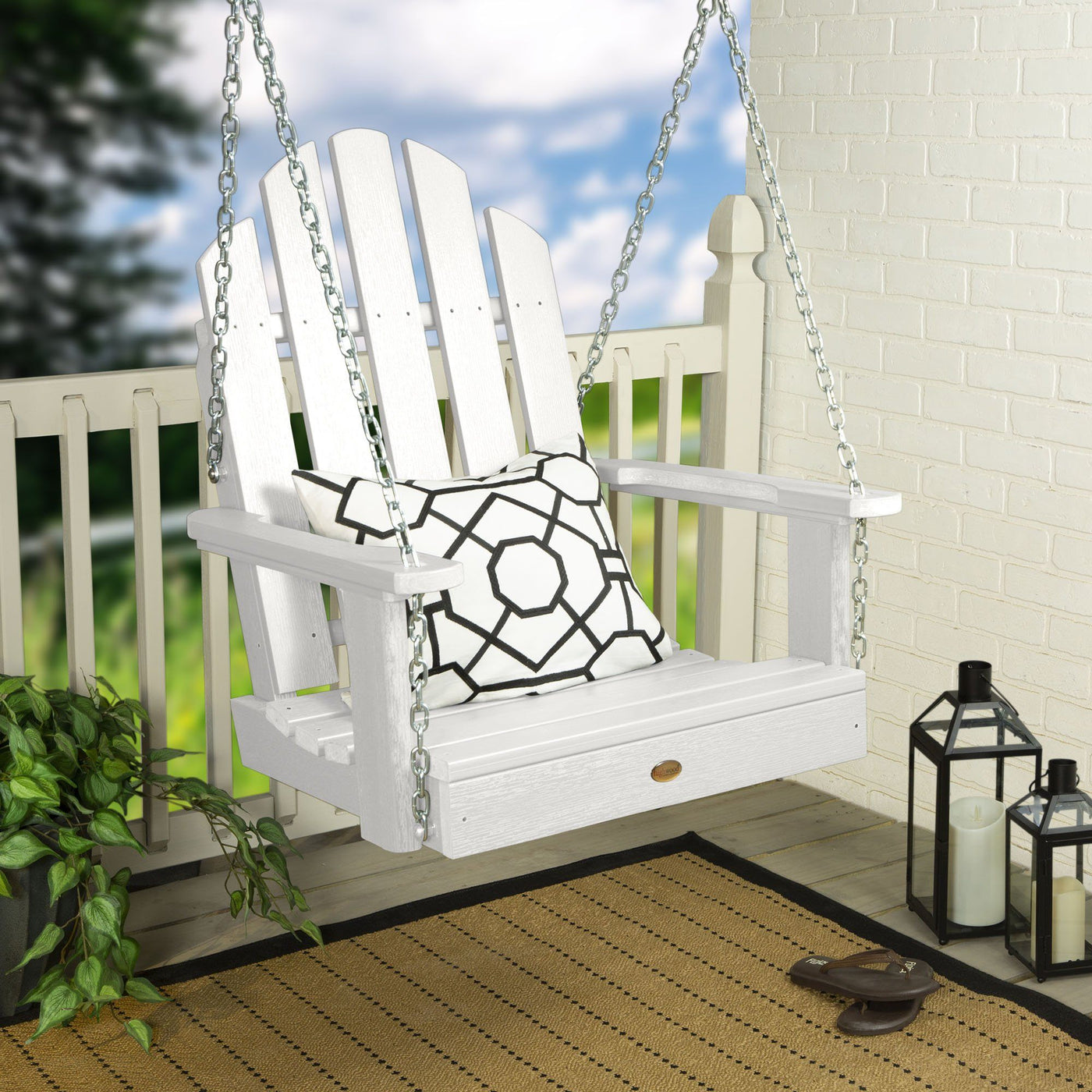 White Single Seat Westport Swing on porch with pillow