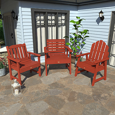 Two red Lehigh garden chairs and red Weatherly garden chair on stone patio. 