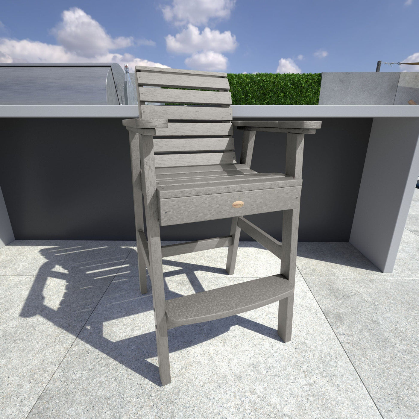 Light gray Weatherly Bar Height Chair in outdoor kitchen