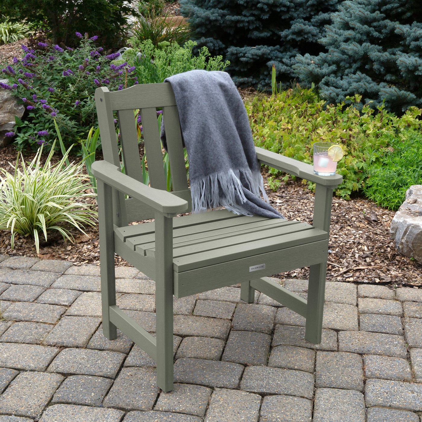 Grey Lehigh garden chair on patio with blanket