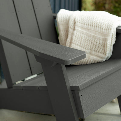 Close up of Gray Italica Modern Adirondack Chair with blanket