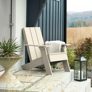 Whitewash Italica Modern Adirondack chair on porch with blanket and lantern