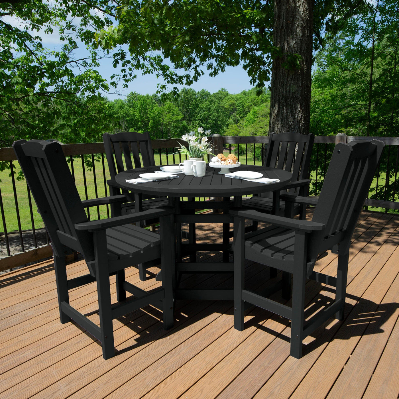 Round dining set in dark gray/black finish on deck