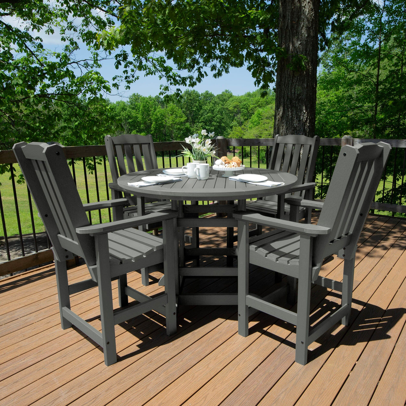 Round dining set on deck in gray finish