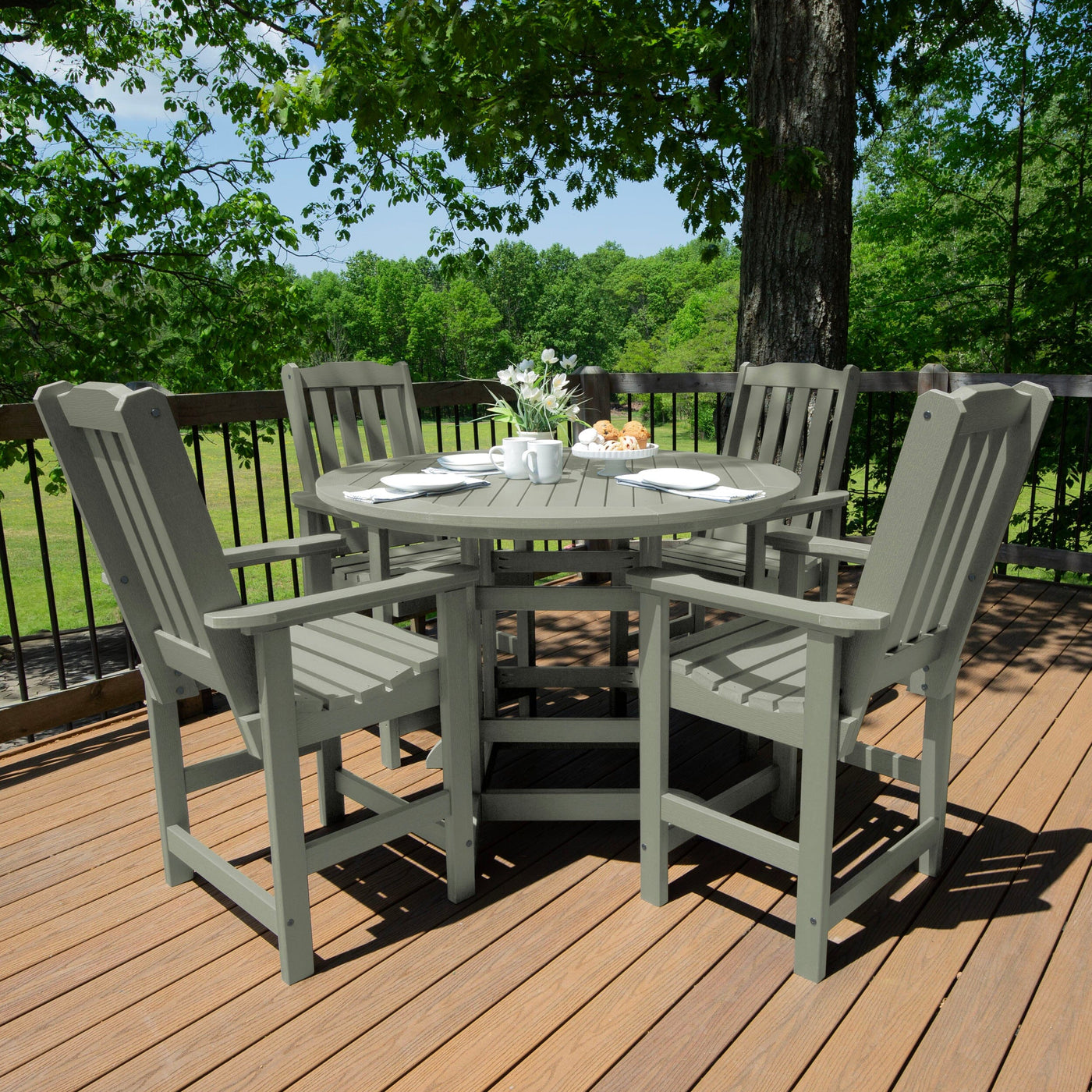 Gray round dining set on deck