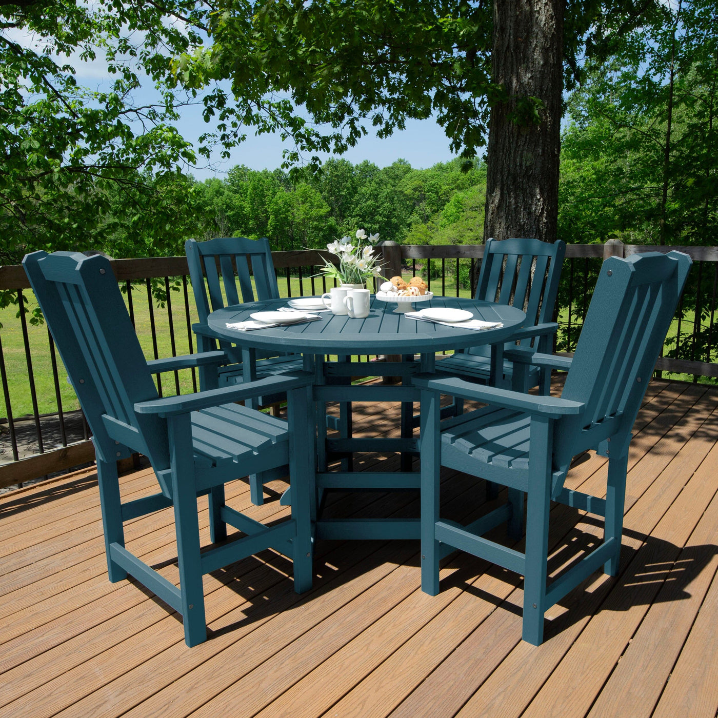 Round dining set on deck with gray finish