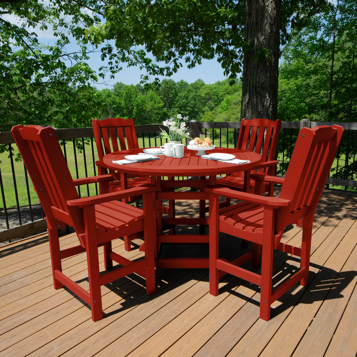 Red round dining set on deck