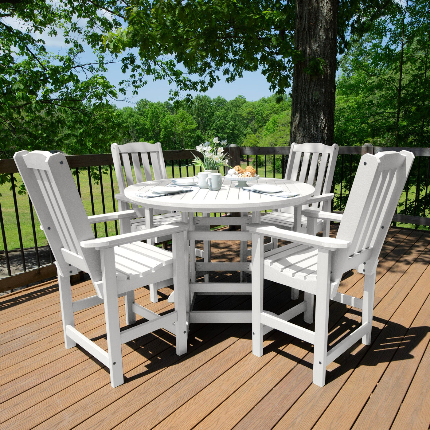 Beige round dining set on deck with place settings