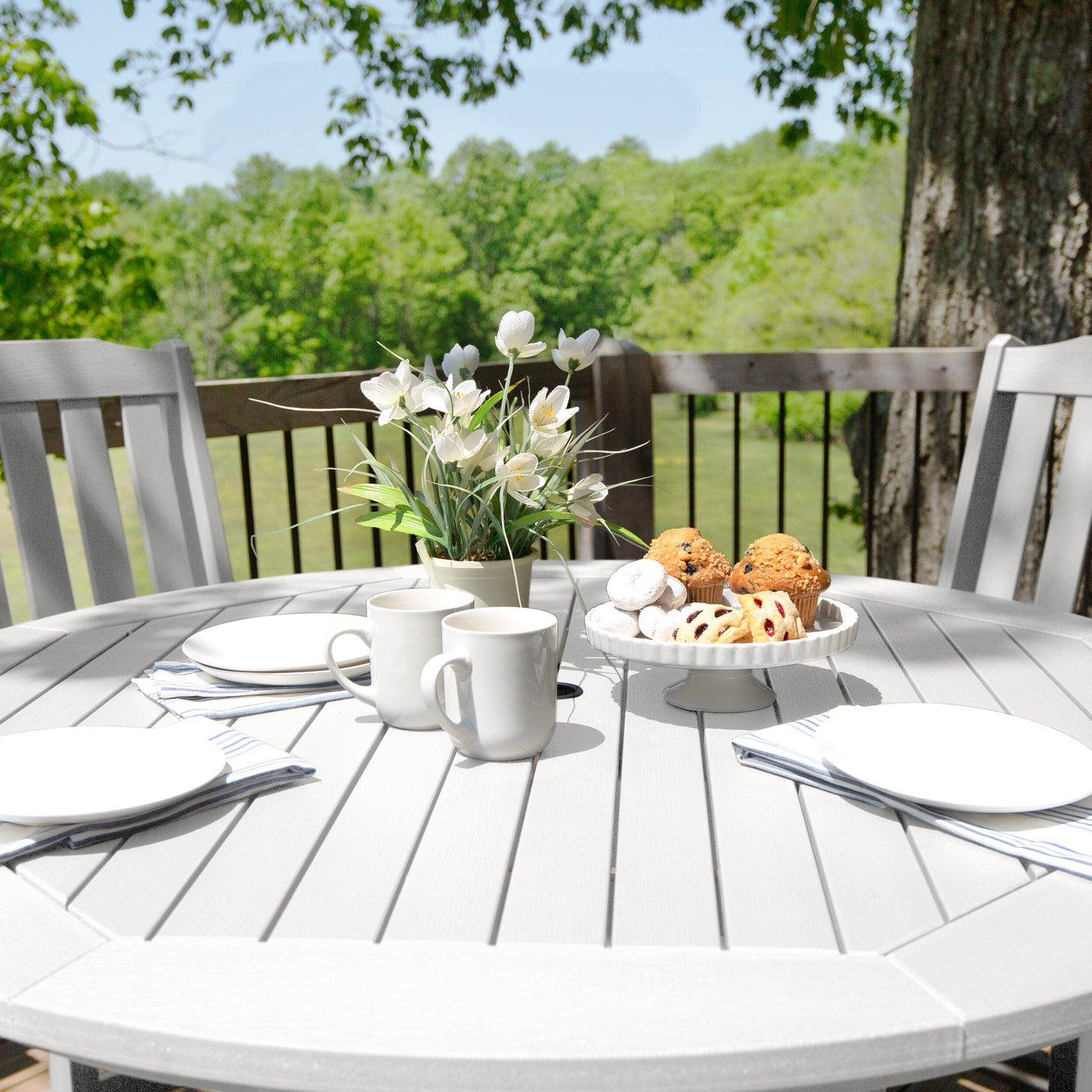 Beige round dining set with tableware