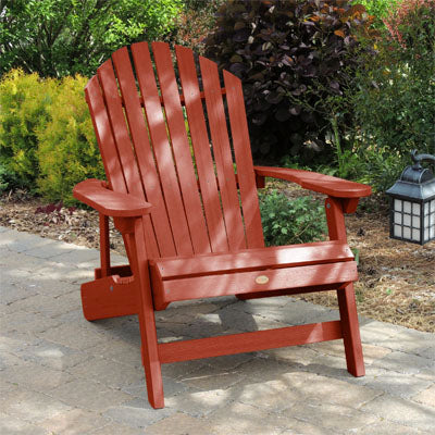 Red Hamilton Adirondack chair on paved walkway. 