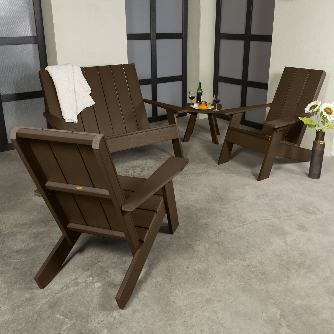 Brown Italica 4-piece set on porch with decorations and wine. 