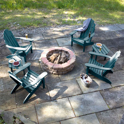 4 Westport Adirondack Chairs and 2 side tables in blue around stone fire pit. 