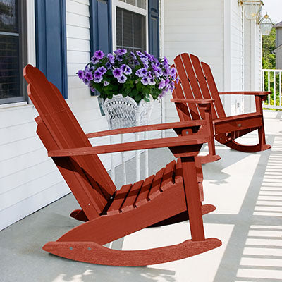 Two red Westport Adirondack chairs on white porch. 