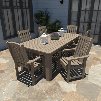 Light brown 42in x 84in Lehigh dining set on patio area. 