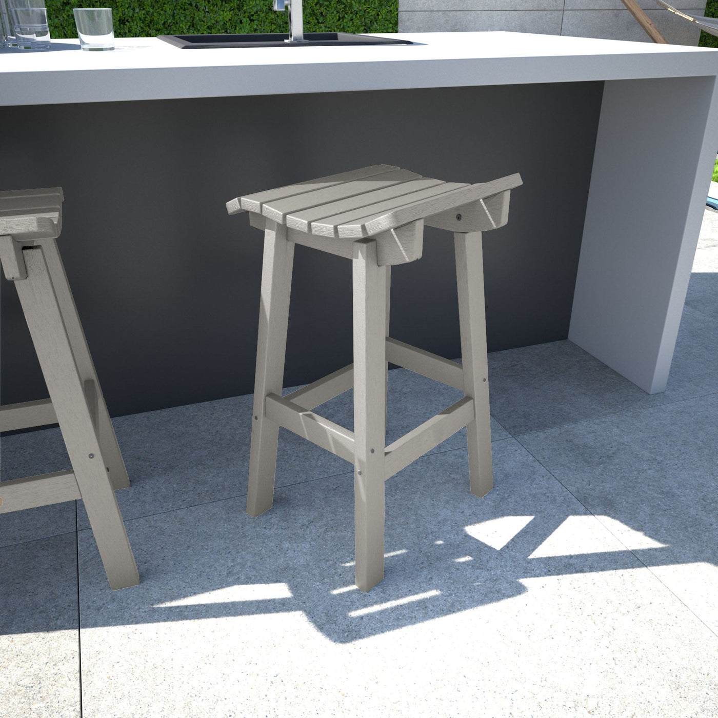 Light gray Summit Bar Stool in outdoor kitchen area