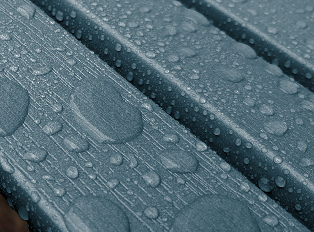 Close-up of HDPS poly lumber with water droplets