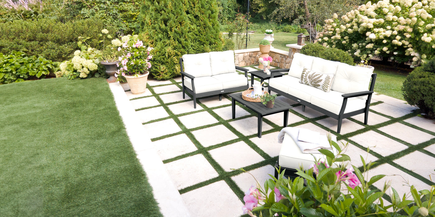 Outdoor patio with deep seating garden furniture and plants
