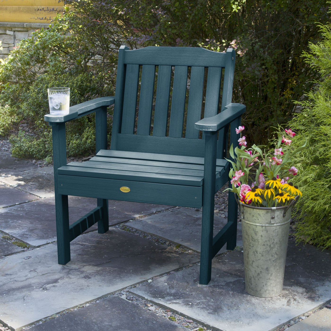 Blue chair in garden with flower pot