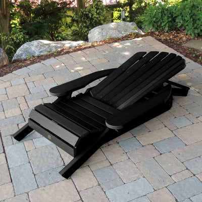 Folded Hamilton Adirondack chair in Black on stone
