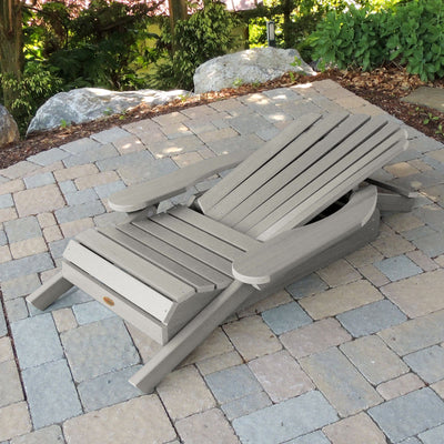 Folded Hamilton Adirondack chair in Harbor gray on stone