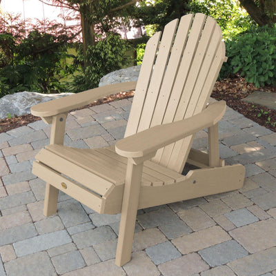 Light tan Hamilton Adirondack chair on stone patio