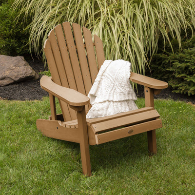 Toffee brown Hamilton Adirondack chair on grass with blanket