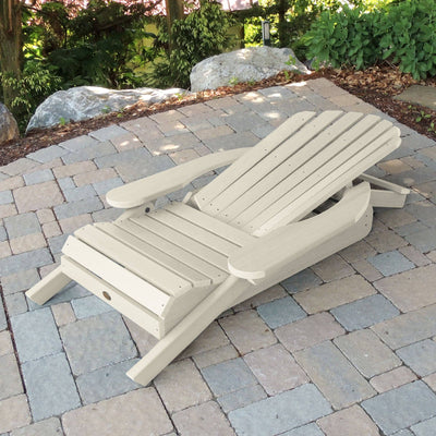 Folded Hamilton Adirondack chair in Whitewash on stone