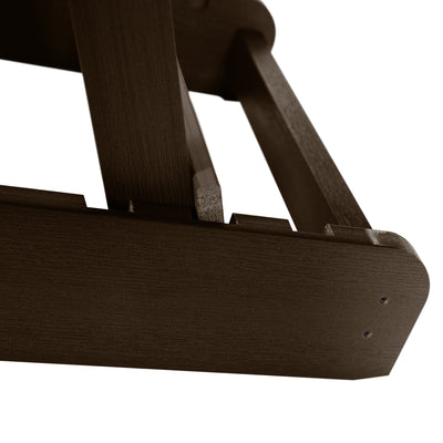 Close up of folding mechanism for brown Hamilton Adirondack chair