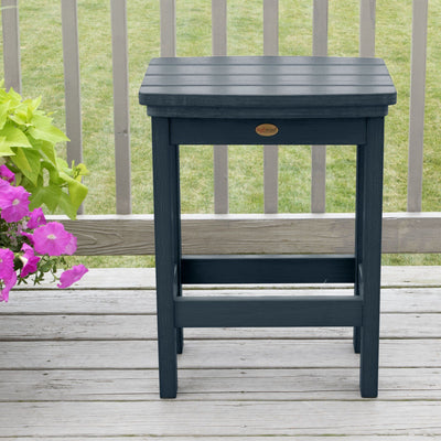 Federal Blue Lehigh counter height stool on deck with flowers 