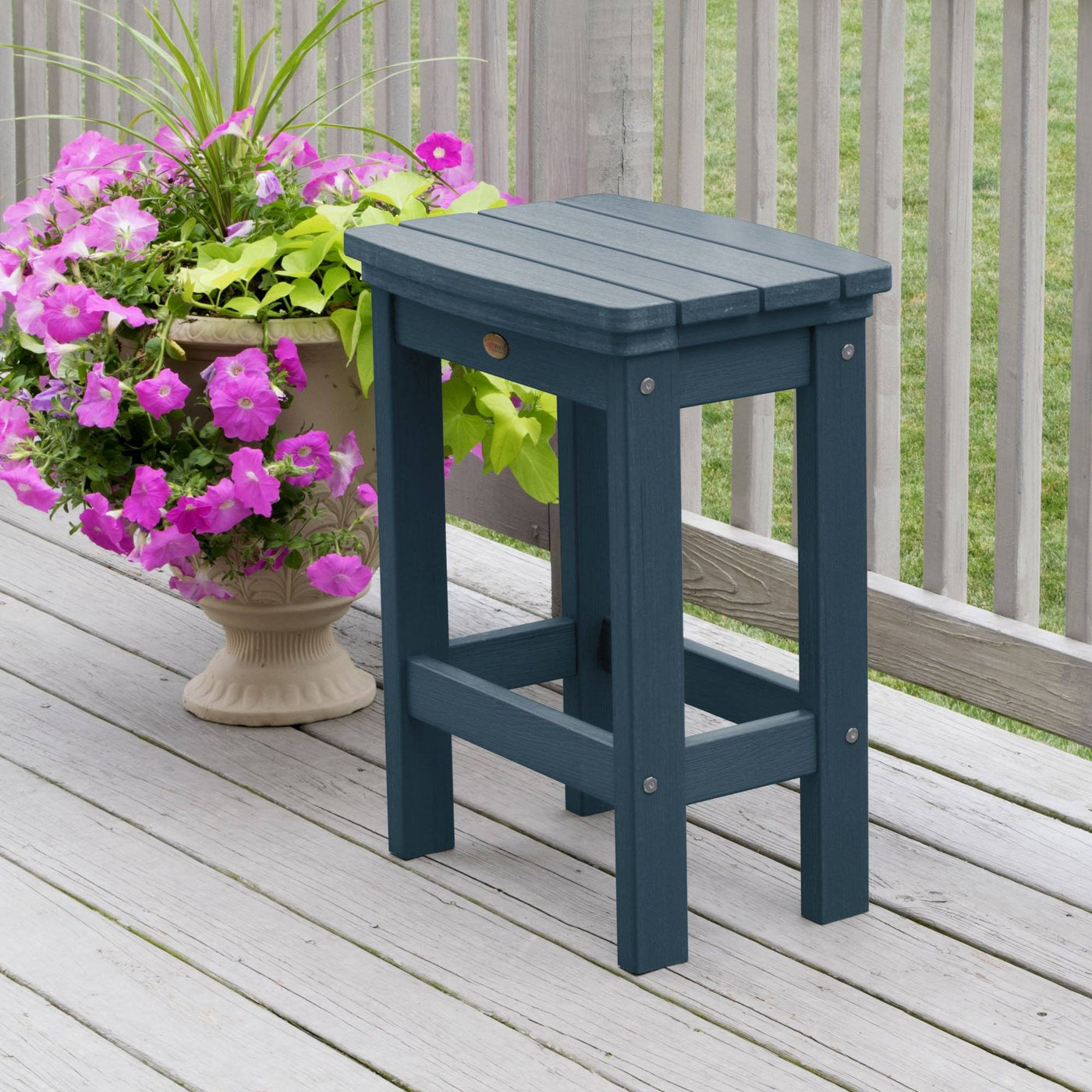 Nantucket blue Lehigh counter height stool on deck with flowers 