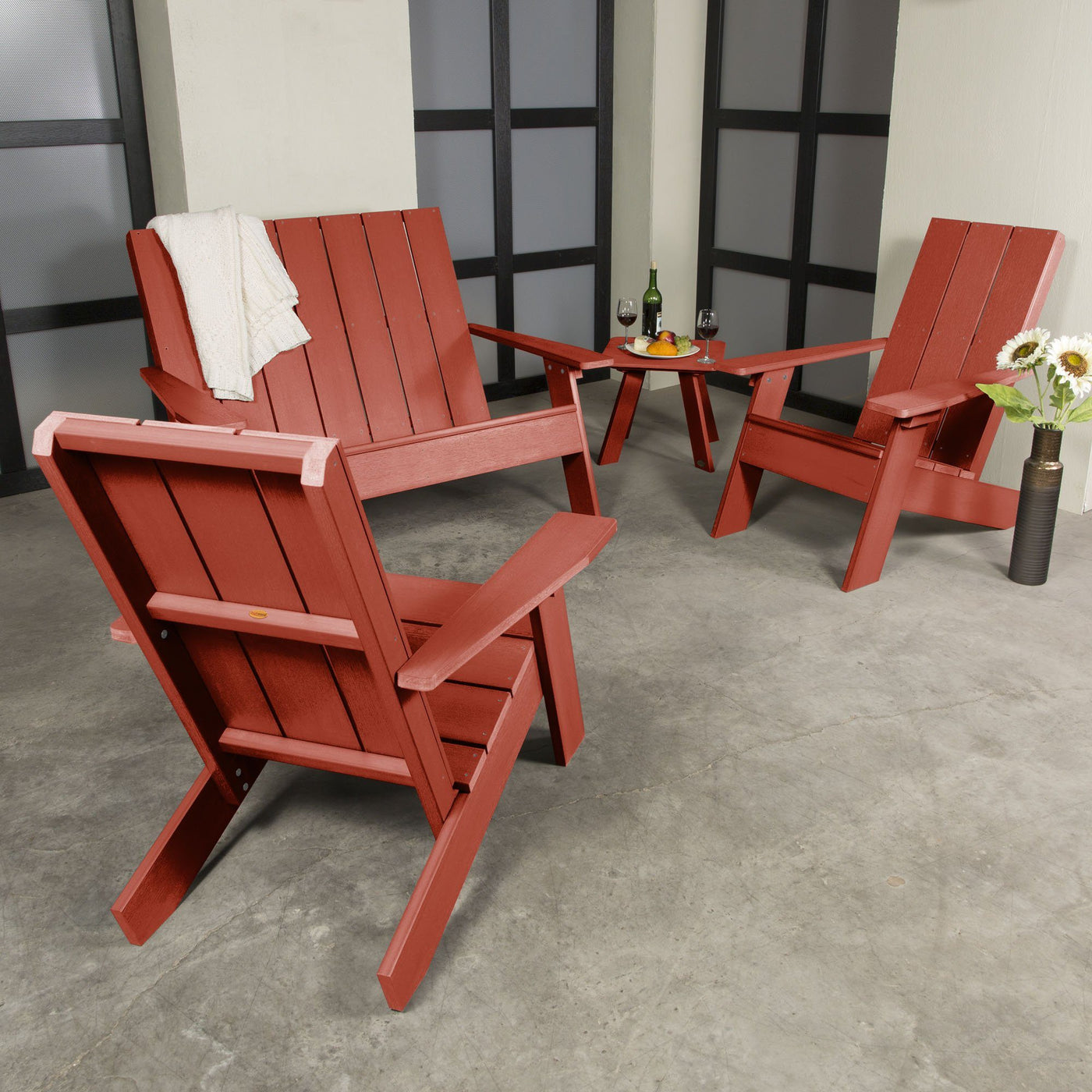 Red Italica 4-piece set on porch with decorations and wine. 