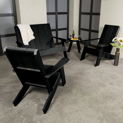 Black Italica 4-piece set on porch with decorations and wine. 