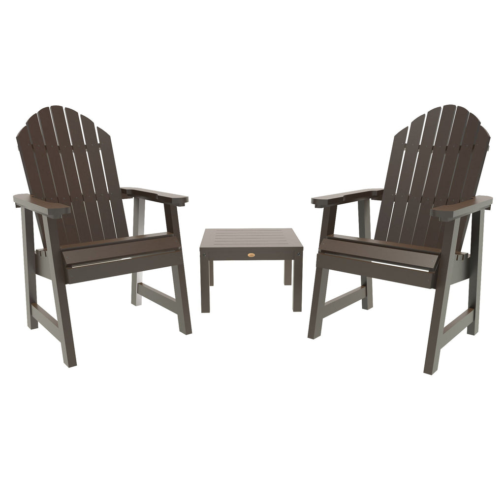 Two Adirondack chairs with a small table between them, all in brown
