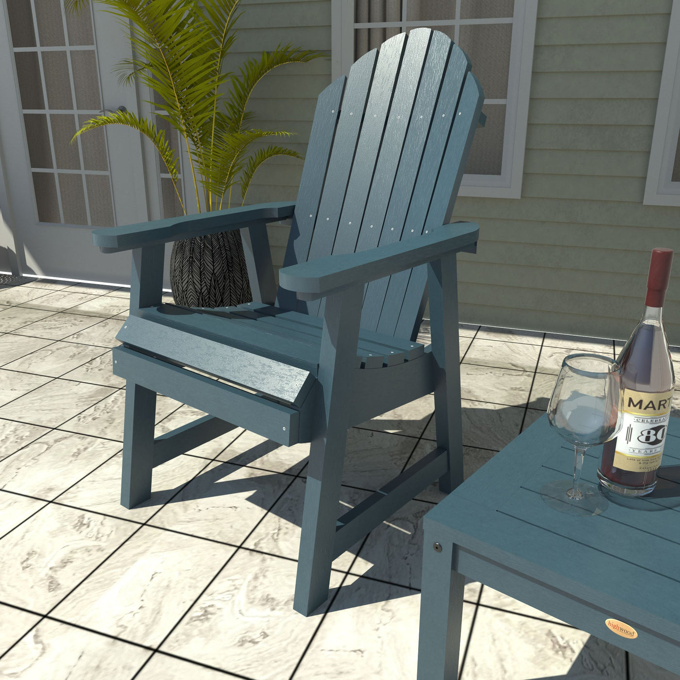 Blue Adirondack chair with matching table