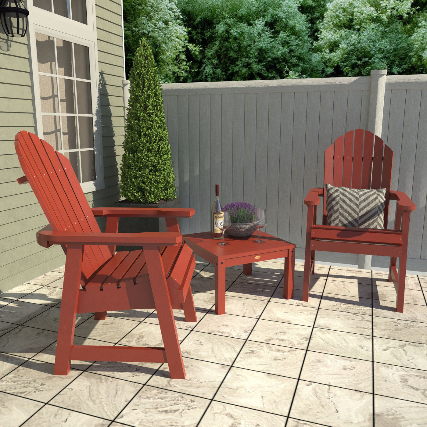 Red Adirondack chairs with table