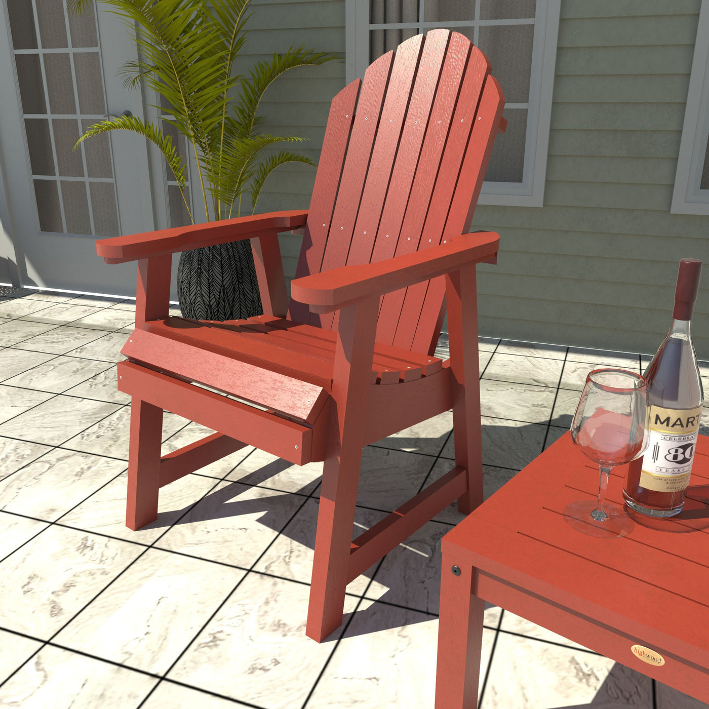 Red Adirondack chair with table