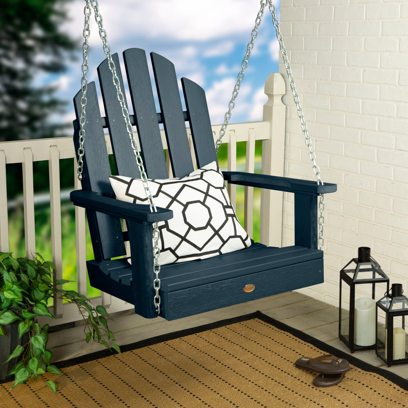Dark Blue Single Seat Westport Swing on porch with pillow